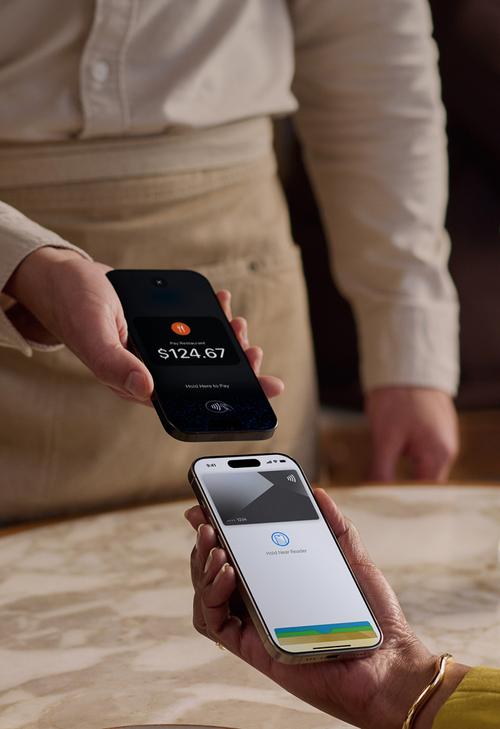 Two iPhones tapping together to complete a transaction with Tap to Pay